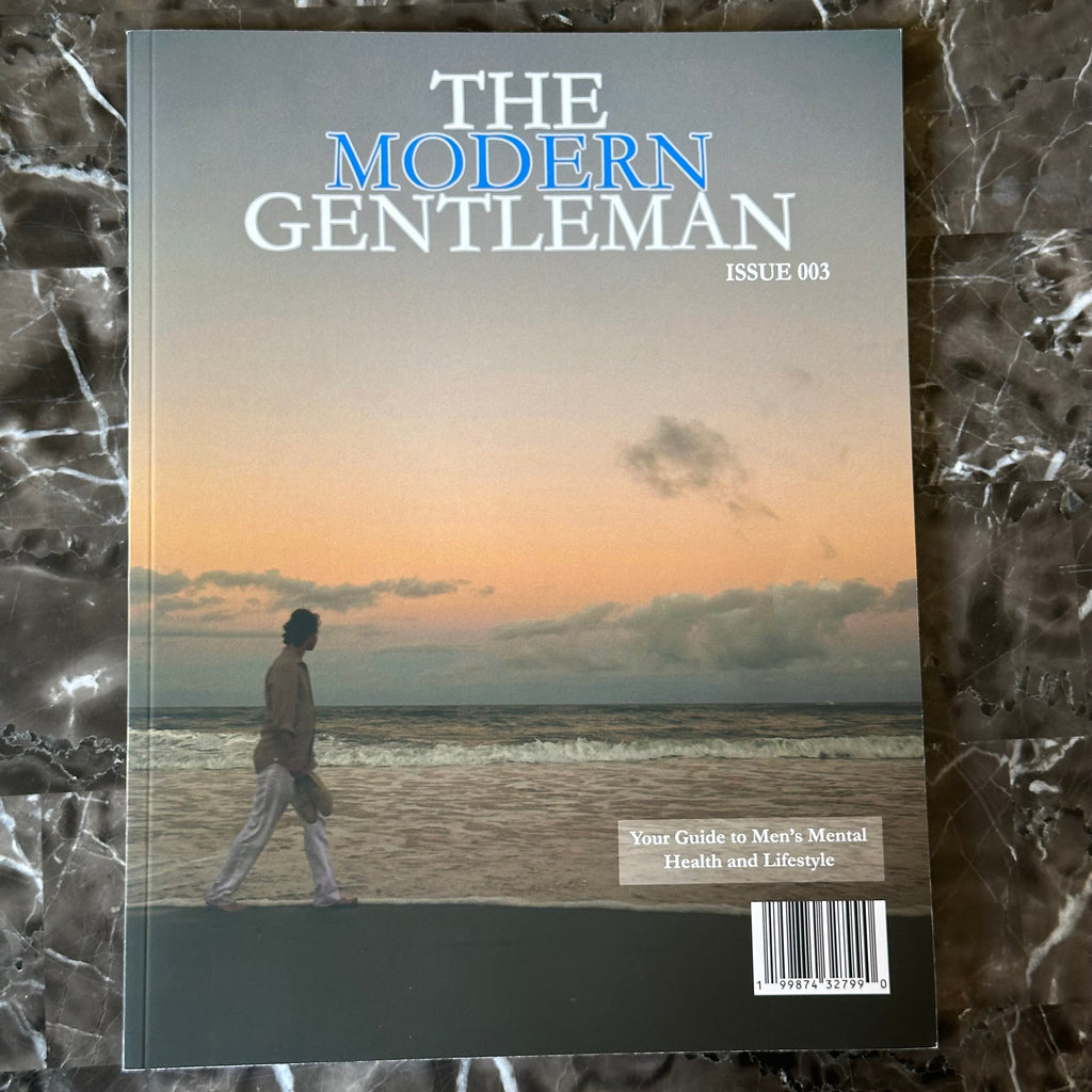 Magazine titled 'The Modern Gentleman issue 003' on a marble surface
